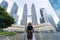 A woman tourist is sightseeing the Petronas Twin tower KLCC in Kuala Lumpur.