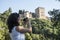 Woman tourist taking pictures in La Alhambra, Granada, Spain