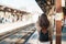 Woman tourist waiting train and Visiting in Kamakura, Kanagawa, Japan. happy Traveler sightseeing Kamakura train station. Landmark