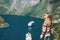 Woman tourist walking over Geiranger fjord in Norway