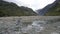 Woman tourist walking in trail of fox glacier new zealand