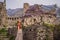 Woman tourist walks through the old town of Bar in Montenegro. Happy tourist walks in the mountains. Suburbs of the city