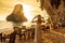 Woman tourist in white dress dinner in restaurant cave on Phra nang Beach at sunset, Railay, Krabi, Thailand. vacation, travel,