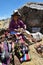 Woman trades traditional souvenirs in Chinchero, Peru