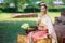 Woman in traditional clothes fold lotus flower petals used in rituals of Buddhism religion. A Lotus represents purity of body