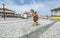 Woman in traditional clothes at Nazare town square