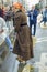 A woman in traditional country clothes wearing clogs during the sheep transhumance festival passing through Madrid Spain