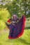 Woman in traditional gypsy dress posing in nature in spring