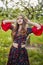 Woman in traditional gypsy dress posing in nature in spring