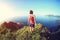 Woman trail runner running on seaside mountain