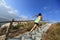 Woman trail runner running up on mountain stairs