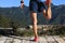 Woman trail runner warming up on top of mountain