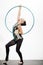 Woman train acrobatics with hula hoop in sportswear. Fitness and dieting of girl gymnast. Woman with gymnastic ring