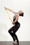 Woman train acrobatics with mace. Sport success and health. Workout sports activities in gym of flexible girl. Fitness