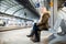 Woman on train station platform waiting