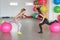 Woman trainer in fitness club. Individual training. Fitness and health concept. Healthy body. Young woman goes in for sports.