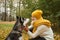 Woman training dog husky in the park