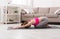 Woman training yoga in child`s pose