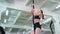 Woman trains on a rope in the gym.