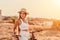 Woman travel bike. Happy woman cyclist sitting on her bike, enjoying the beautiful mountain and sea landscape