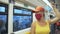 Woman travel caucasian ride at overground train air-train with wearing protective medical mask. Girl tourist at airtrain