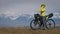 The woman travel on mixed terrain cycle touring with bikepacking. The traveler journey with bicycle bags. Sport tourism