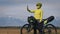 The woman travel on mixed terrain cycle touring with bikepacking. The traveler journey with bicycle bags. Sport tourism