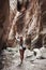 Woman traveler in amazing Avakas gorge, nature landscape, Cyprus. View of the popular canyon tourist