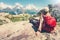 Woman Traveler with backpack admiring of mountains