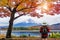 Woman traveler with backpack looking to Fuji mountains in Autumn, Japan.