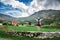 Woman traveler with backpack near mountains