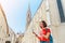 Woman traveler holding map in hands while looking for some interesting tourist sights and destinations