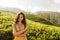 Woman traveler portrait against natural background tea plantations landscape
