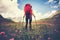 Woman Traveler with red backpack hiking Travel Lifestyle