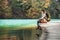 Woman traveler sits on wood bridge and looks calm on mountain la