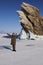 A woman traveler stands at the Dragon Rock on Ogoy Island.