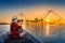 Woman traveler take a photo to fishing dip nets at Pakpra in Phatthalung, Thailand