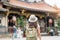 woman traveler visiting in Taiwan, Tourist with hat sightseeing in Longshan Temple, Chinese folk religious temple in Wanhua