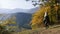 Woman traveler is walking through the mountains and forests