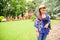 A Woman Traveler with Wat Phra That Song Pee Nong Background at Chiang Saen District