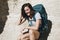 Woman traveling with backpack trekking