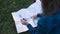 Woman Traveling, Using Map And Compass In Nature