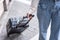 Woman traveller standing and dragging black suitcase luggage walking to passenger boarding in airport, Travel concept