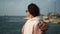 woman is travelling and exploring natural landmark, admiring sea from shore