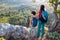 woman travels with a child, A boy and his mother look at the mountains. Hiking and adventures with children