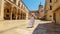 a woman travels through the streets of the old town Dubrovnik, Croatia, medieval European architecture, the concept of traveling