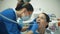 Woman treats teeth at the dentist
