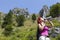 Woman trekker drinking whilst resting high in the mountains