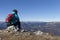 Woman trekker resting in mountains