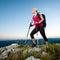 Woman on trekking - Beautiful blonde girl hiking on mountains